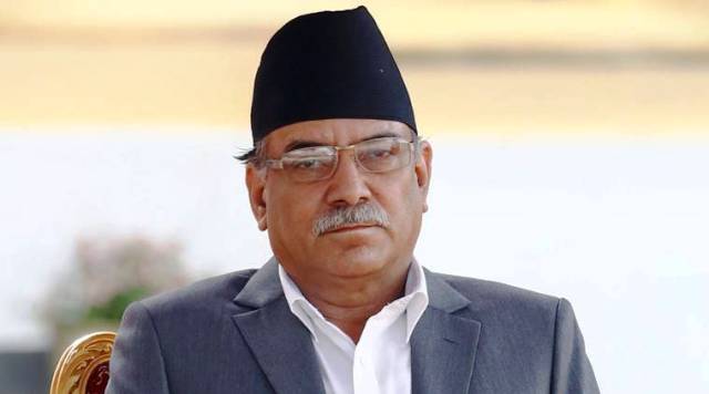 Newly elected Nepalese Prime Minister Pushpa Kamal Dahal, also known as Prachanda, (L) sits on a chair upon his arrival to administers the oath of office at the presidential building "Shital Niwas" in Kathmandu, Nepal, August 4, 2016. REUTERS/Navesh Chitrakar